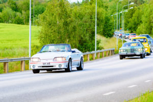 Ronneby, Sweden - June 26, 2015: Veteran car street cruise on public roads. Ford mustang gt white 1987.